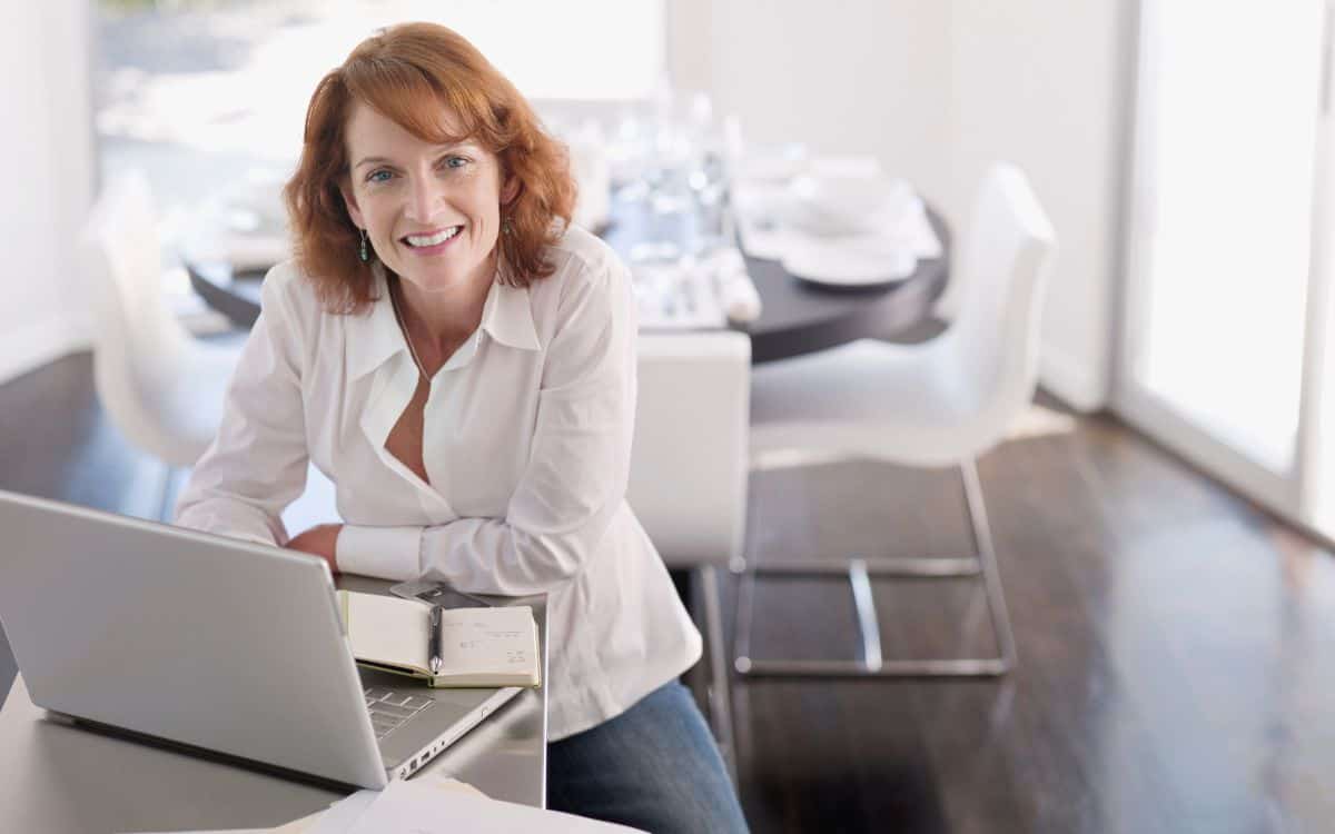 A woman in front of a laptop at home_How To Make Money as a Stay at Home Mum