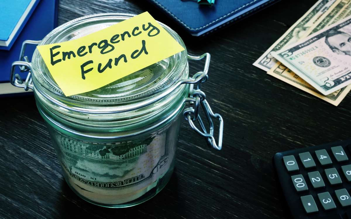 An emergency fund jar filled with money