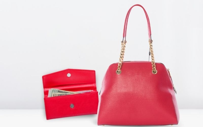 Photo of a red purse and wallet with money