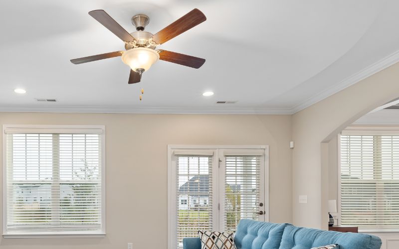 A ceiling fan in a bright living room